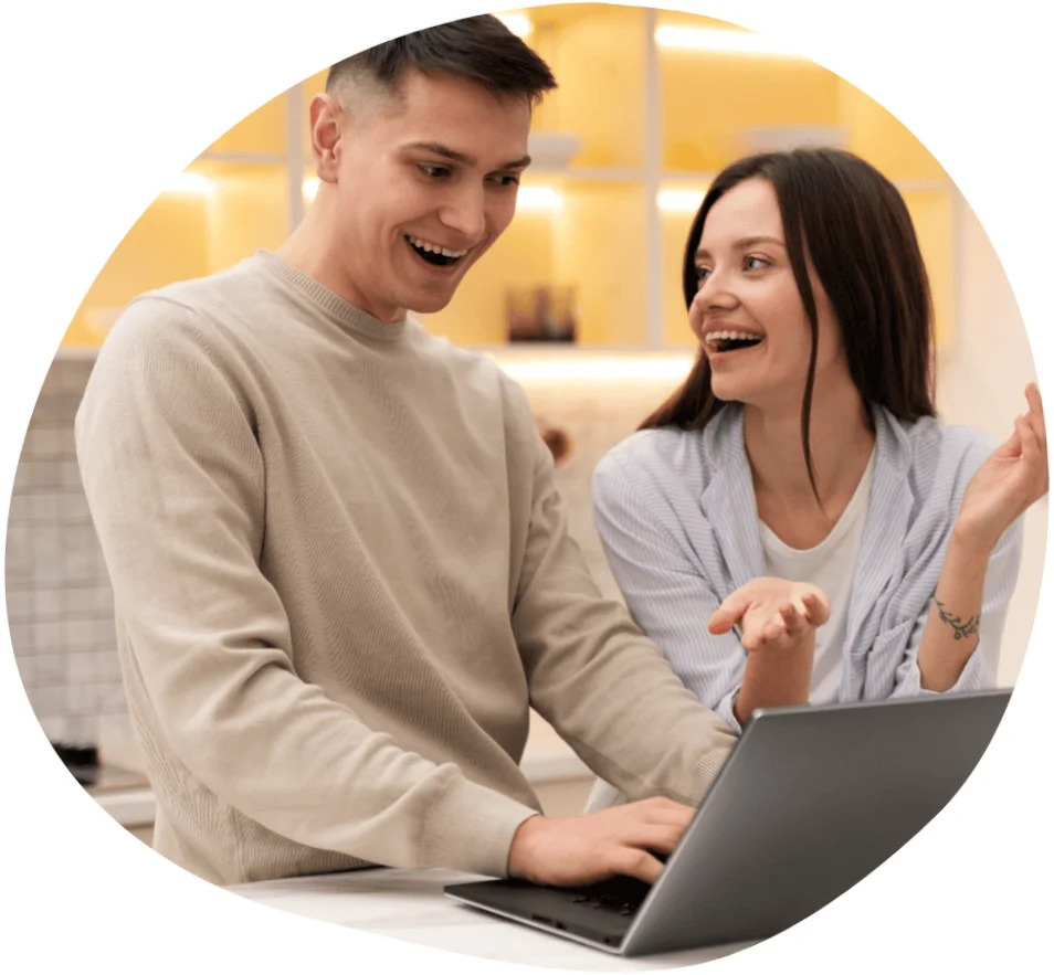 Two people discussing a digital project, representing experts working on technology.