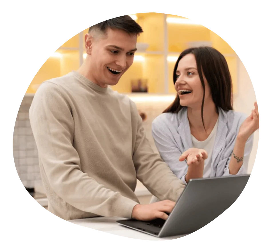 Two people discussing a digital project, representing experts working on technology.